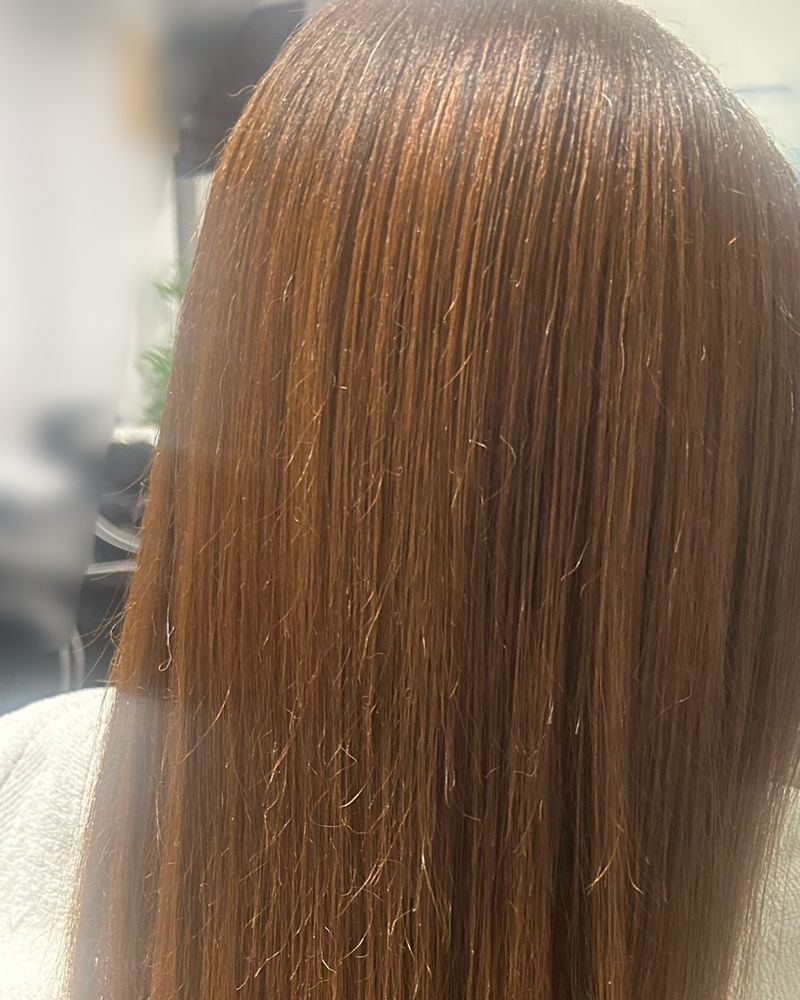 Long copper-brown silk press, straight from crown to ends