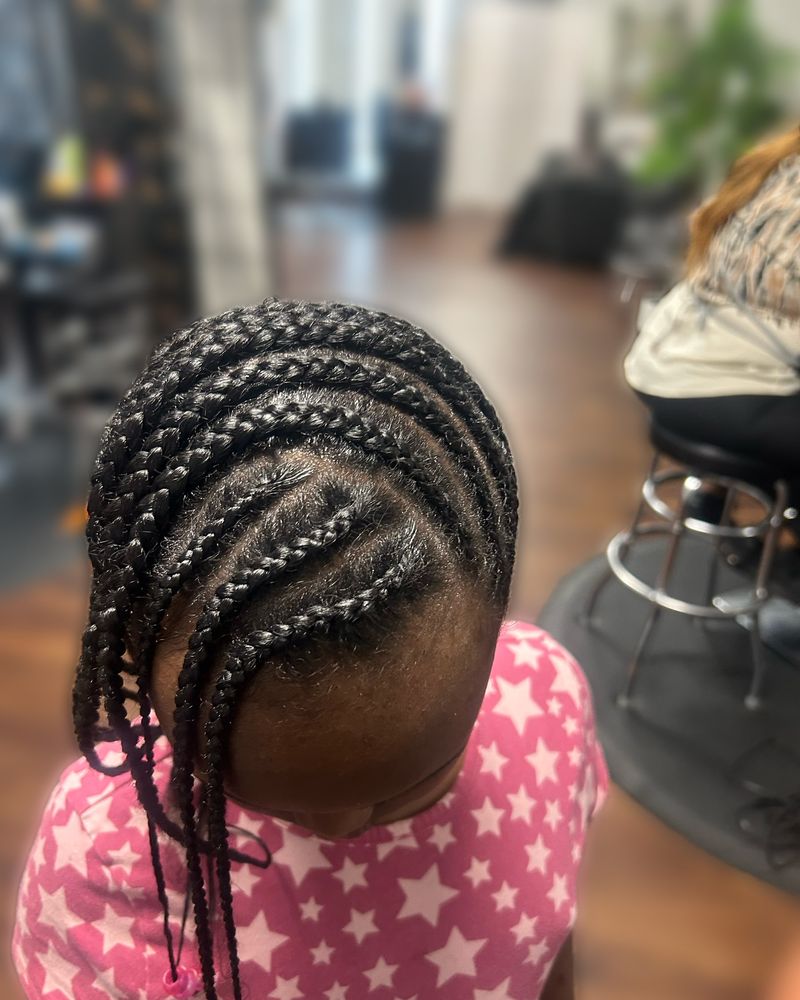 Child's side-swept cornrows, seen from above