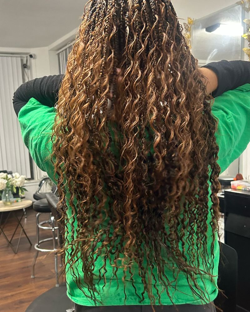 Long boho knotless braids with honey highlights and curly ends
