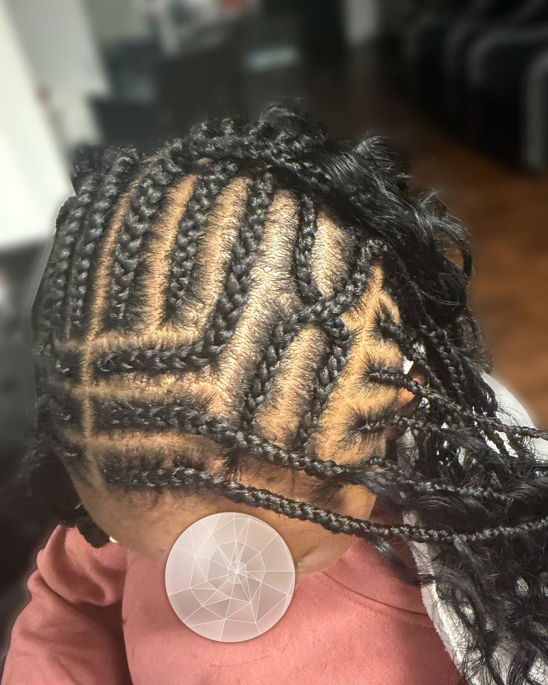 Geometric cornrow pattern with curly boho braids, close-up