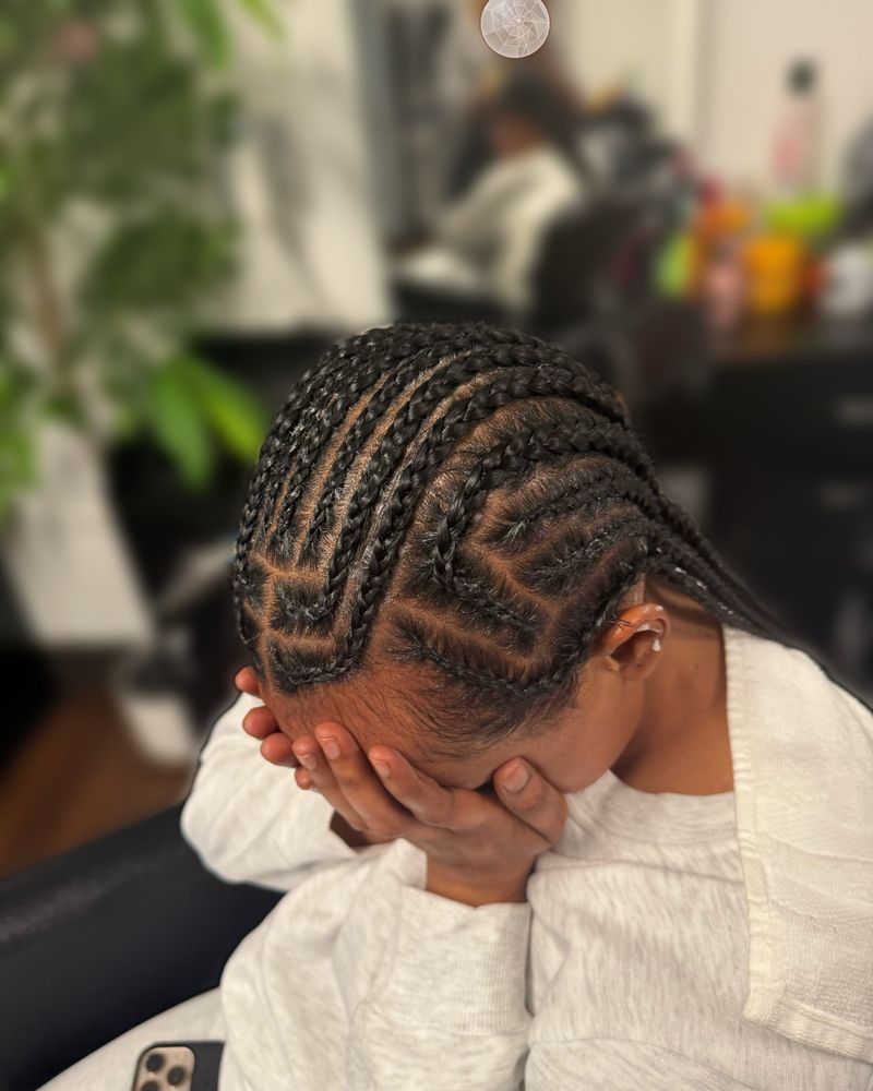 Zig-zag cornrows swept to one side