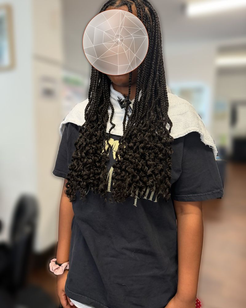 Shoulder-length knotless braids with curly ends, front view